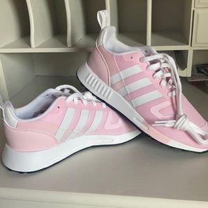 Never worn/ brand new pink adidas size 8.5 fits like a 9